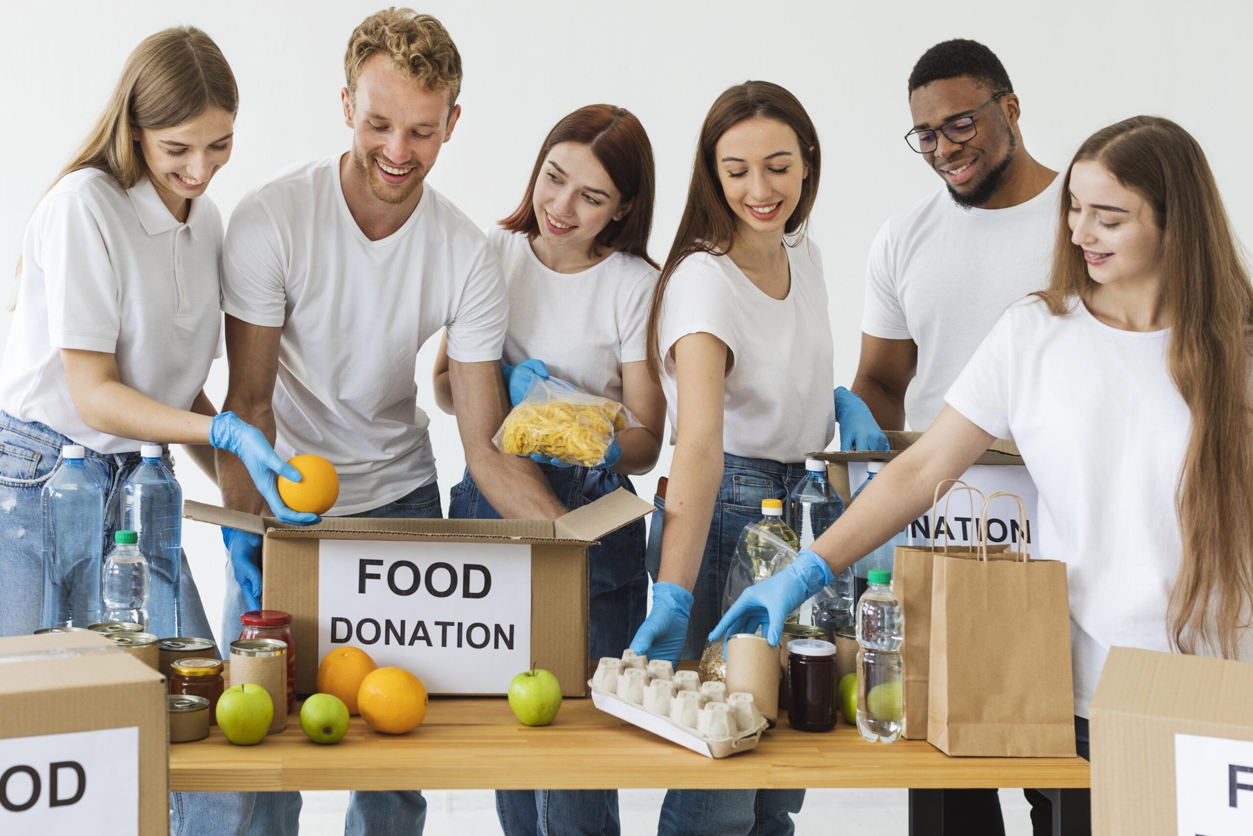smiley-volunteers-preparing-boxes-with-food-donation
